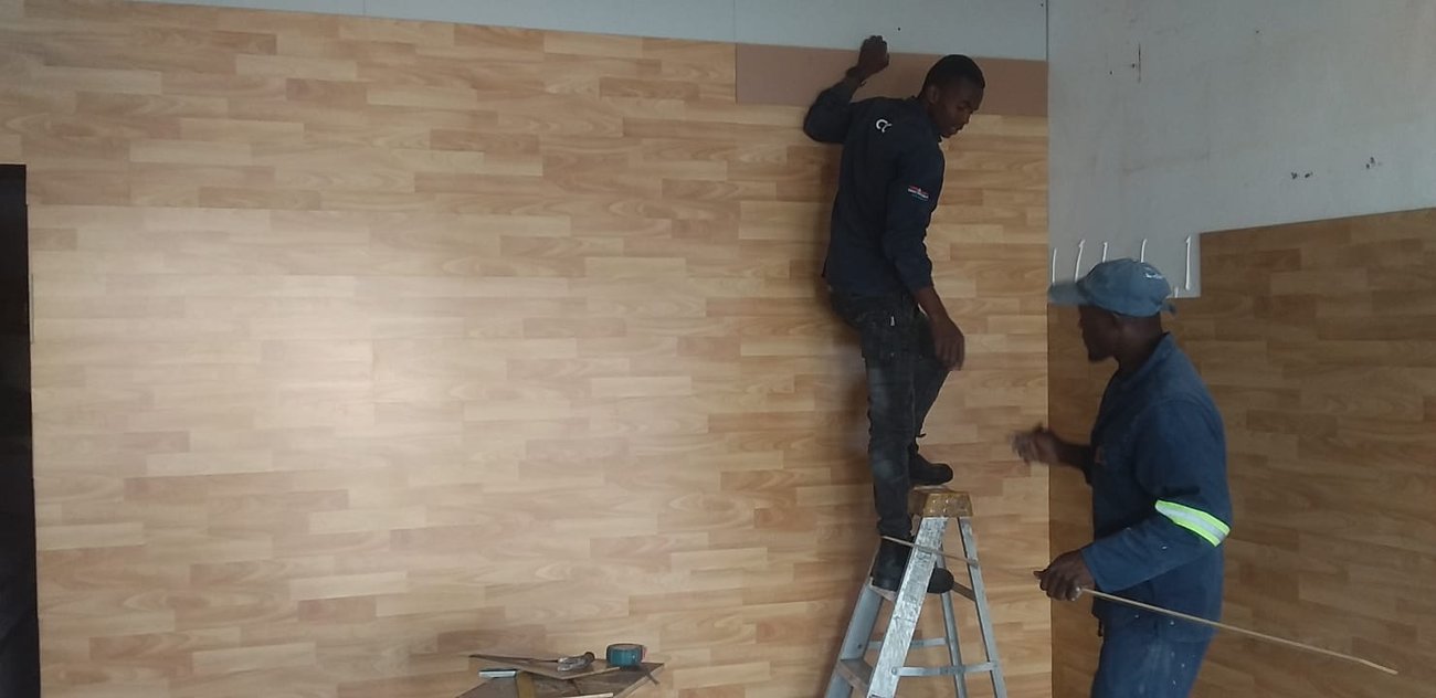 Team laying a tiled floor
